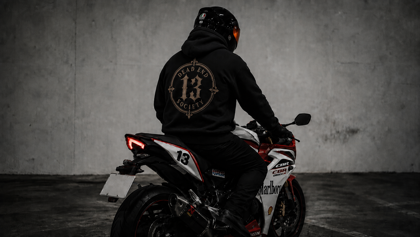Rider on a motorcycle wearing the Dead End Society XIII hoodie
